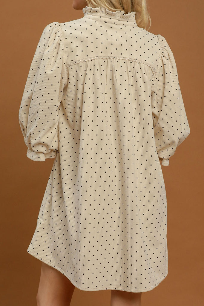 easy to wear midi dress in ecru with petite black polka dots throughout.