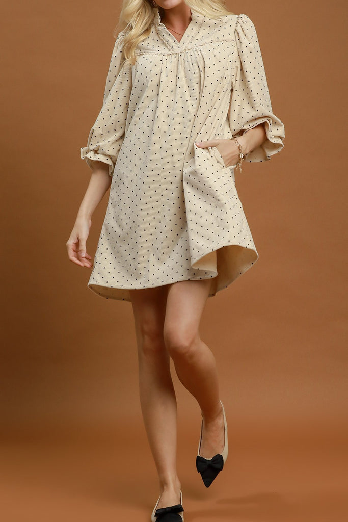 easy to wear midi dress in ecru with petite black polka dots throughout.