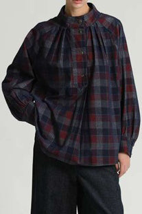 roomy blouse in a dark hued plaid pattern