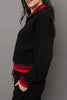 cozy black pullover with red racer stripe detailing.