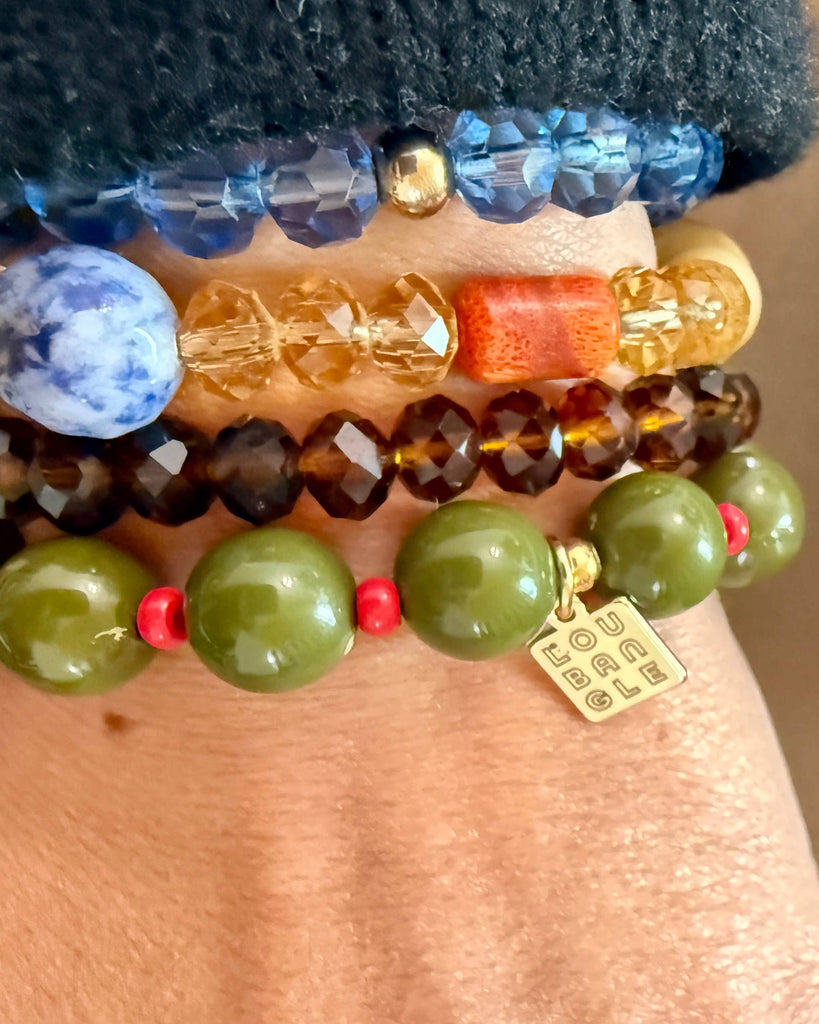 tini bracelet styled with other beaded bracelets 