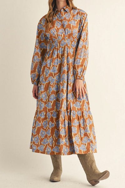 long sleeve midi dress in a pretty toffee brown and cornflower blue floral pattern.