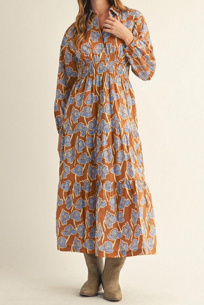 long sleeve midi dress in a pretty toffee brown and cornflower blue floral pattern.