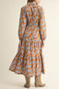 long sleeve midi dress in a pretty toffee brown and cornflower blue floral pattern.