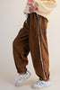 unique joggers made from camel brown baby corduroy with a sweet ditsy floral pattern