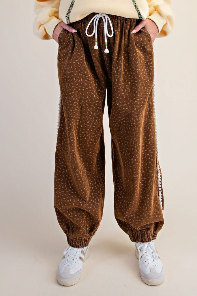 unique joggers made from camel brown baby corduroy with a sweet ditsy floral pattern