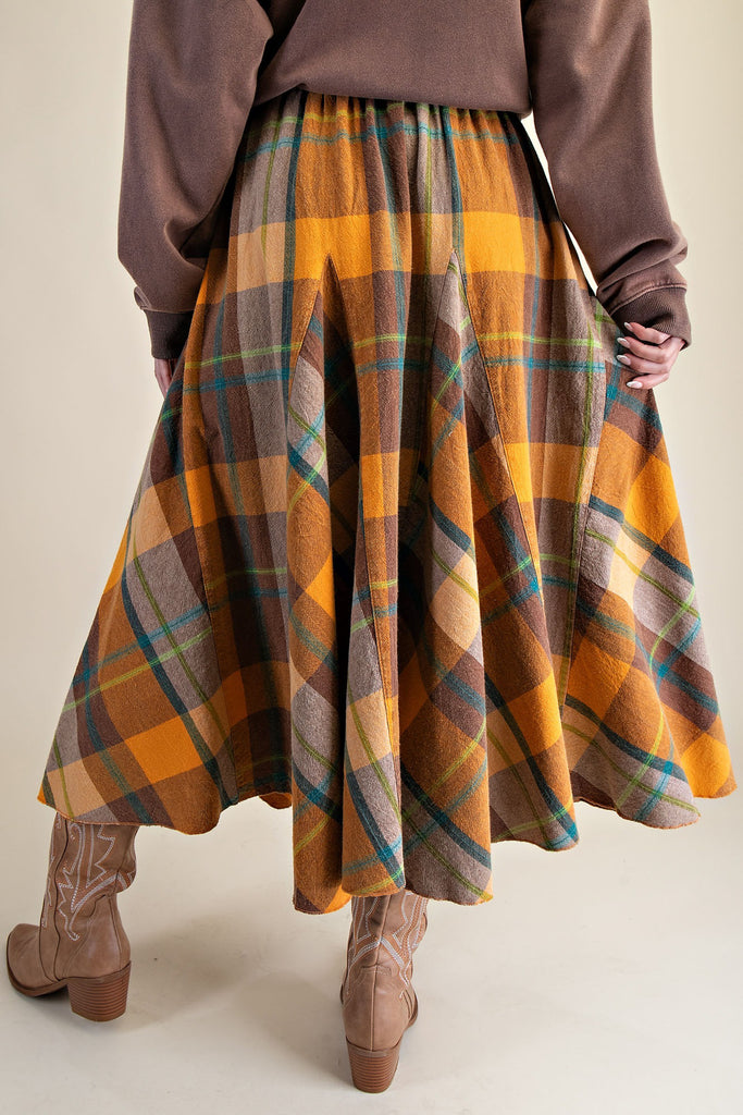 flowy midi skirt in a brown and orange plaid pattern
