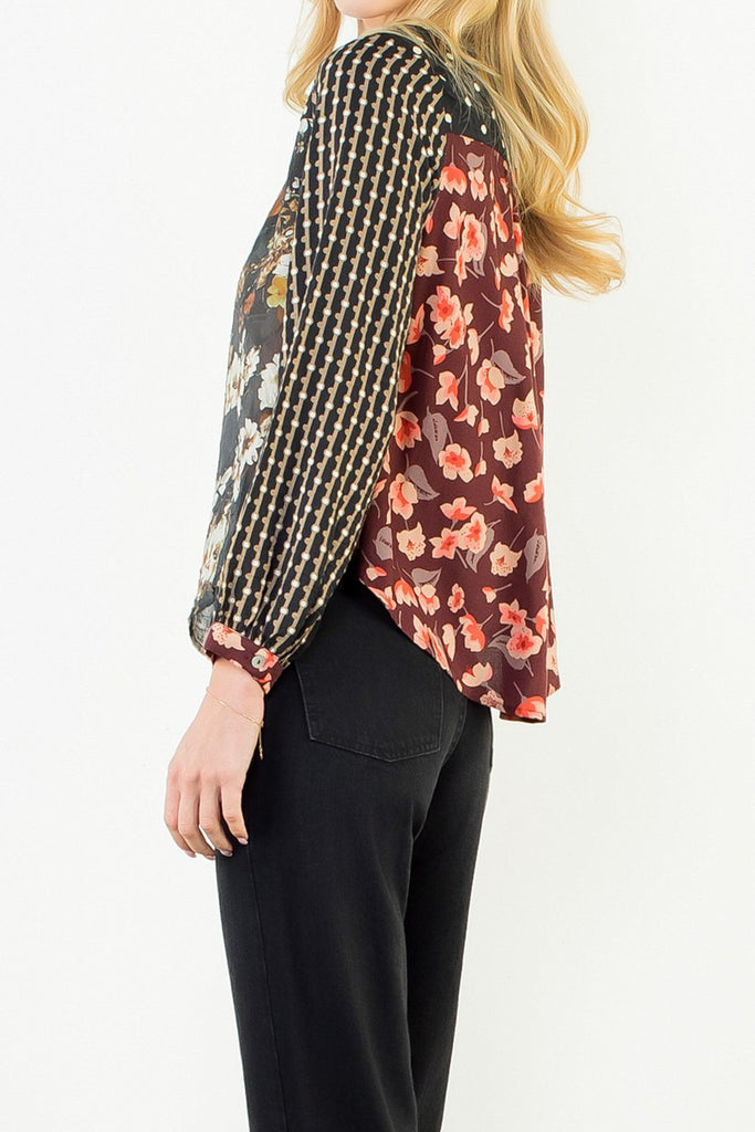 button down top with a striking mixed print design