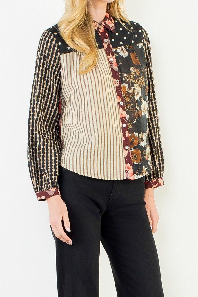 button down top with a striking mixed print design