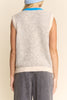 knit sweater vest in cream and light grey with bright blue detailing on buttons, neckline, and pockets
