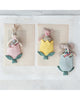 three stuffed animals in a colorful tulip pocket