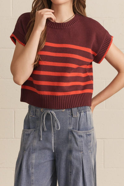 knit top in a deep wine color with bold orange stripes