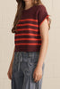 knit top in a deep wine color with bold orange stripes