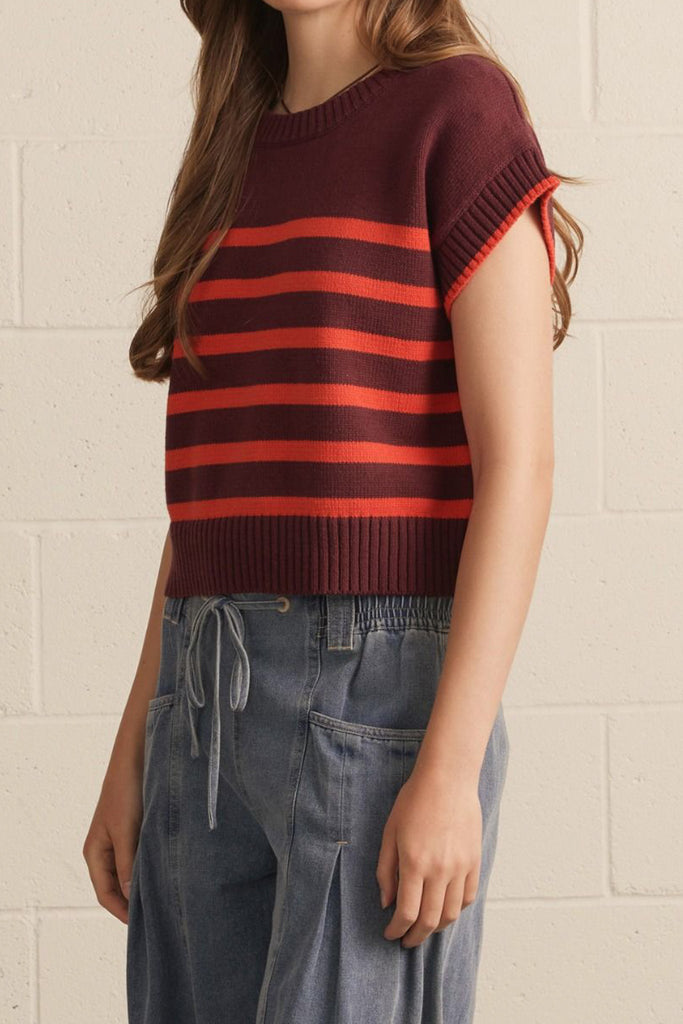 knit top in a deep wine color with bold orange stripes