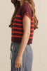 knit top in a deep wine color with bold orange stripes