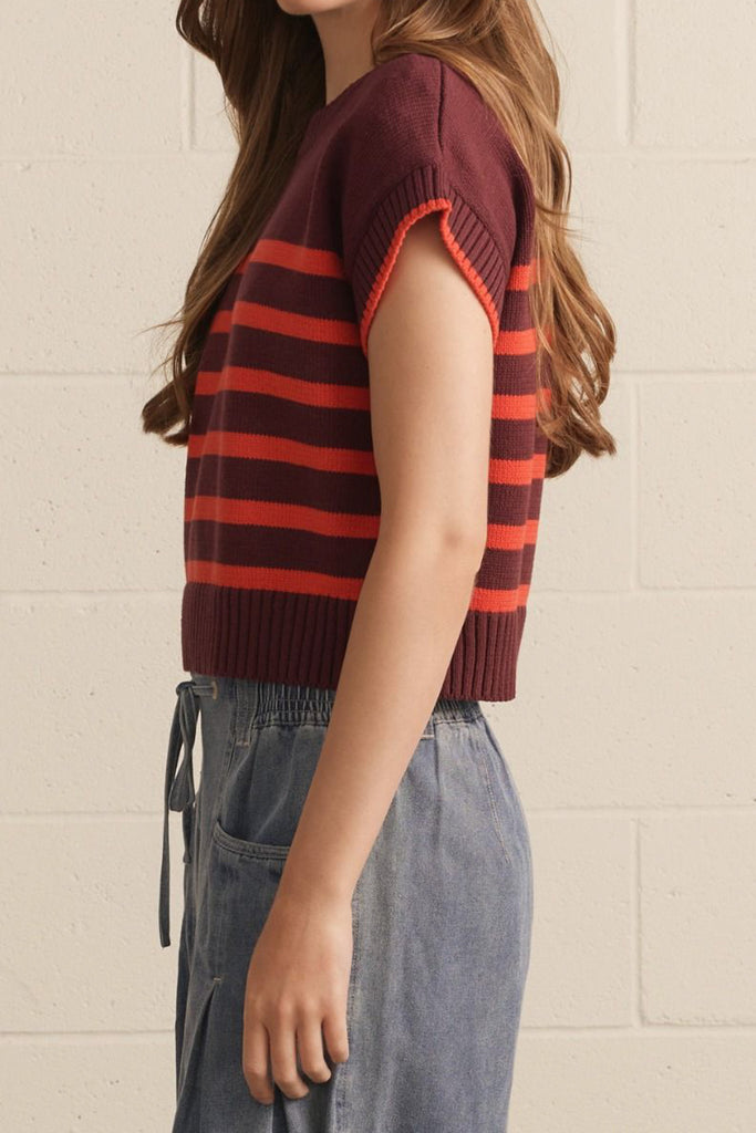 knit top in a deep wine color with bold orange stripes