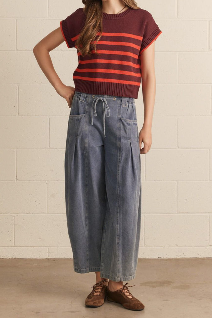 knit top in a deep wine color with bold orange stripes