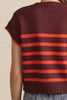 knit top in a deep wine color with bold orange stripes