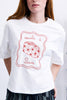 white tee with a travel-inspired embroidered design