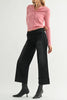 washed black wide leg jeans with a cuffed bottom hem.