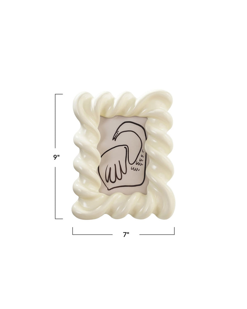 white resin picture frame with a wavy design