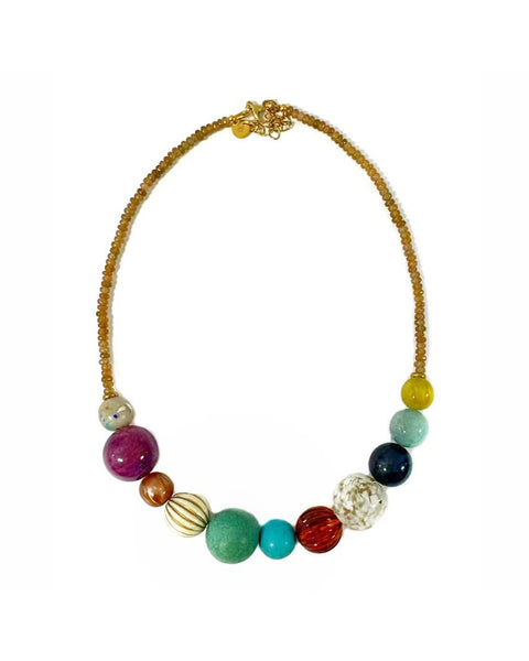 trendy beaded necklace with shimmery tan faceted beads and oversized gumball style beads in an array of colors and textures
