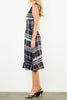 striking sleeveless midi dress in a dark plaid pattern with a special zippered front
