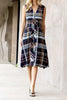 striking sleeveless midi dress in a dark plaid pattern with a special zippered front