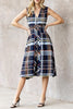 striking sleeveless midi dress in a dark plaid pattern with a special zippered front