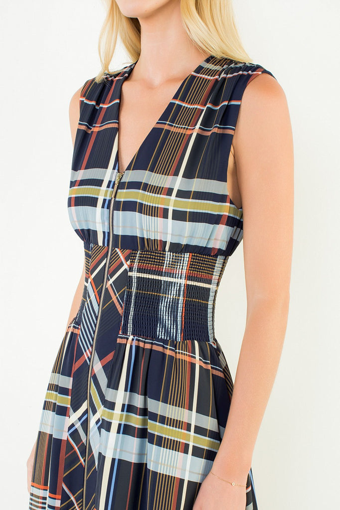 striking sleeveless midi dress in a dark plaid pattern with a special zippered front