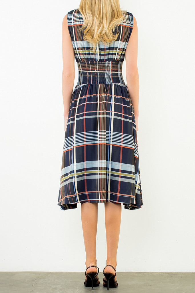 striking sleeveless midi dress in a dark plaid pattern with a special zippered front