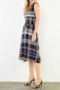 striking sleeveless midi dress in a dark plaid pattern with a special zippered front