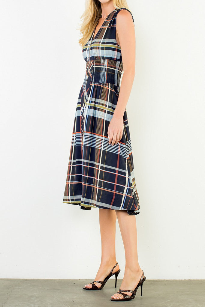 striking sleeveless midi dress in a dark plaid pattern with a special zippered front