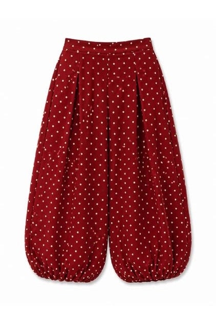 uniquely shaped pants in deep wine with cute polka dots throughout