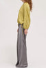 muted lime green velvet blouse with a unique crinkled texture.