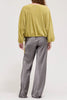 muted lime green velvet blouse with a unique crinkled texture.