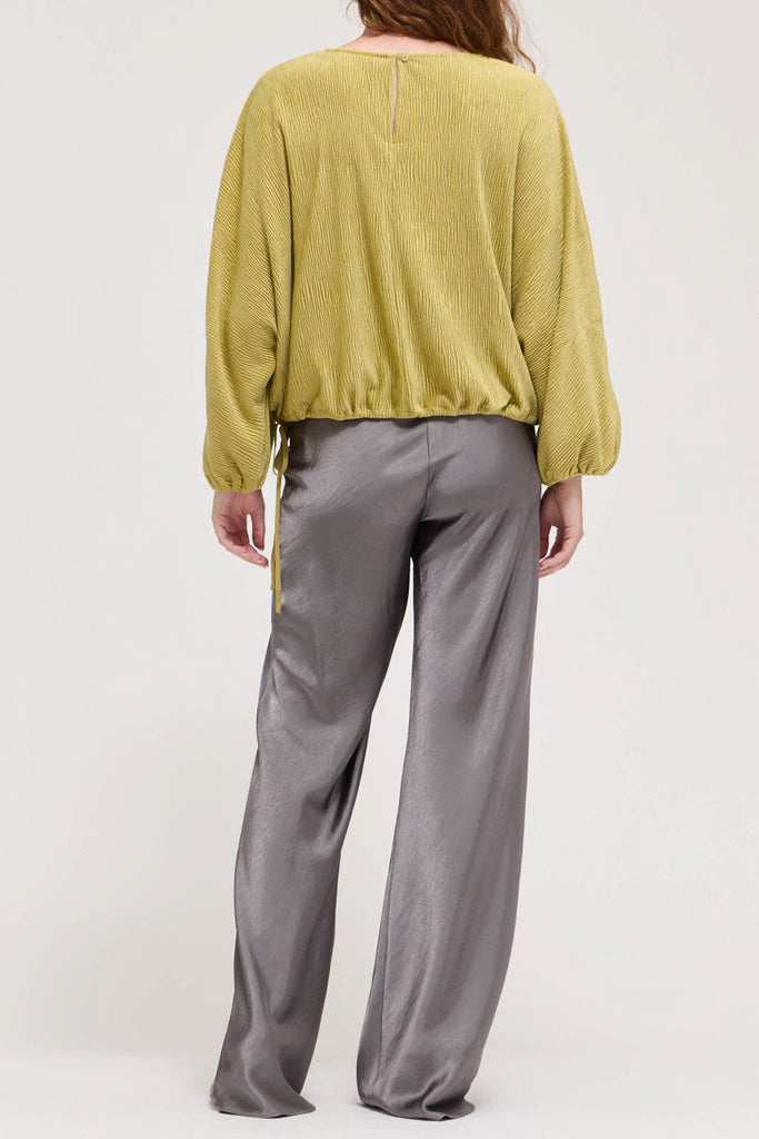 muted lime green velvet blouse with a unique crinkled texture.