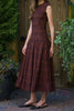 striking midi dress in a dark plaid pattern with smocked details