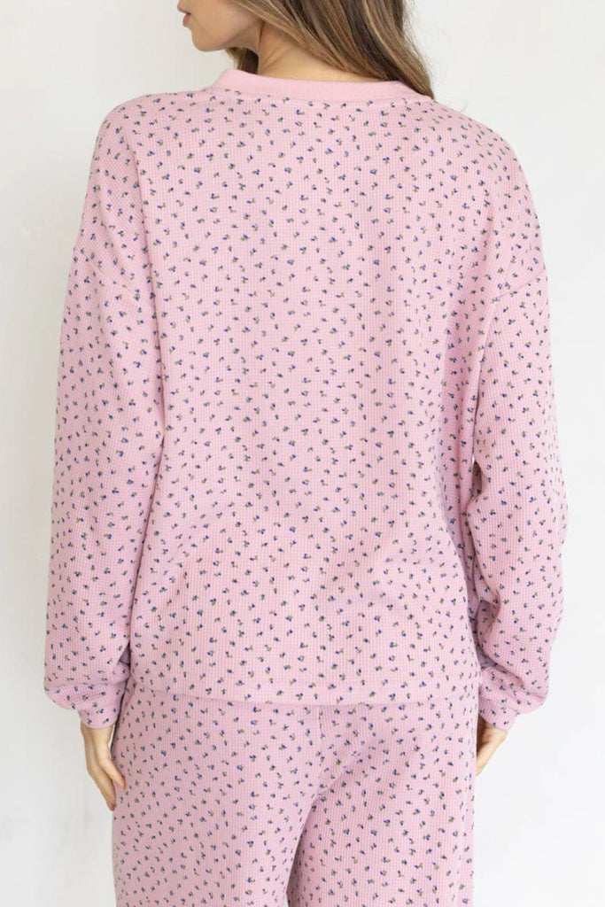baby pink henley top with a sweet ditsy floral pattern